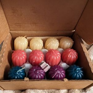 Home Interiors box of 12 votive candles. Scented like perfume. Asstd colors